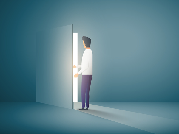 Man opening door to outside light