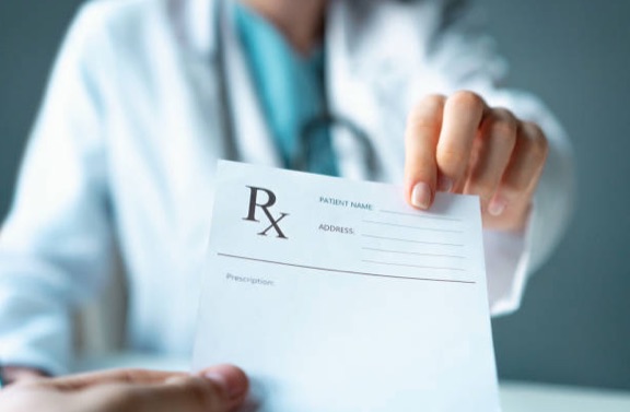 Doctor holding prescription